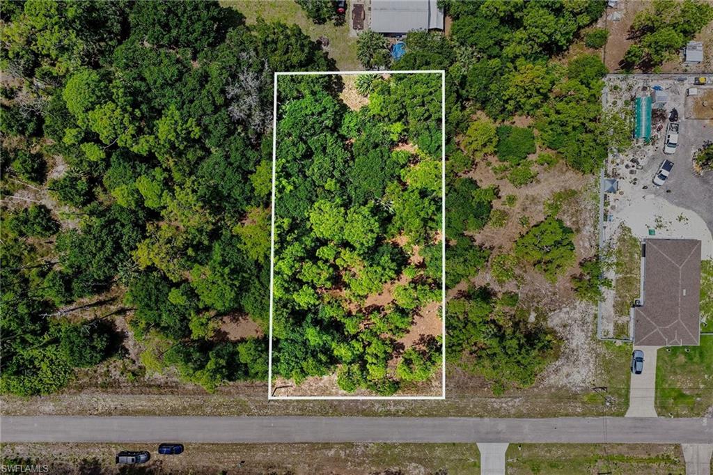 711 Wellington Ave Lehigh Acres FL - lot outlines are approximate and buyer to verify with survey or other means
