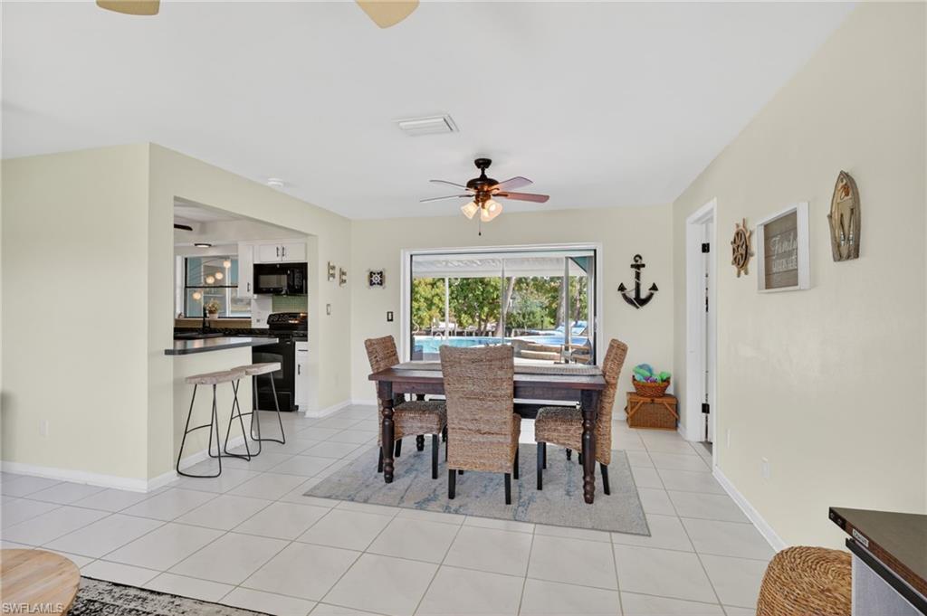 Dining area with pool and canal views