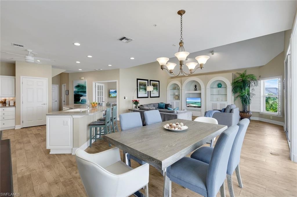 Open-concept living area with wood-finish flooring