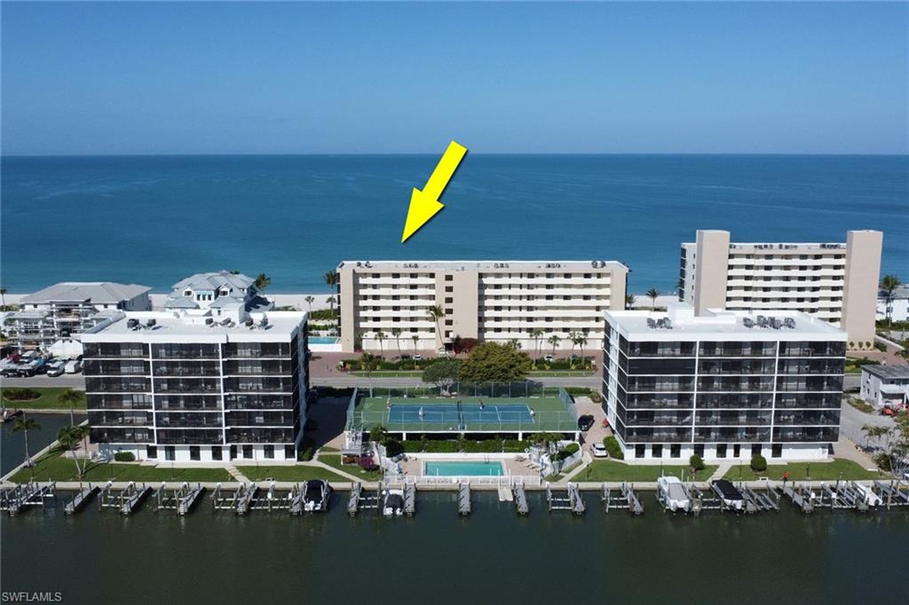 Coastal condominium building featuring multiple levels of private balconies