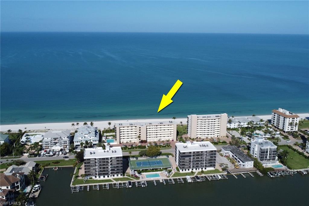 Beachfront condominium building with direct access to a white sand beach and the Gulf of Mexico