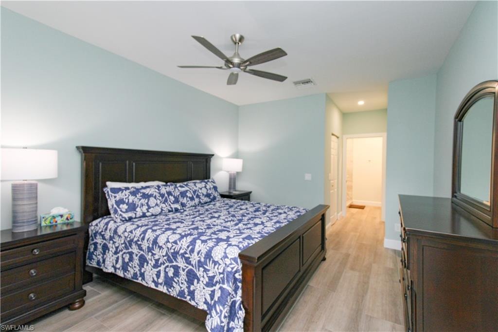 Bedroom featuring a closet, ceiling fan, and light hardwood / wood-style floors
