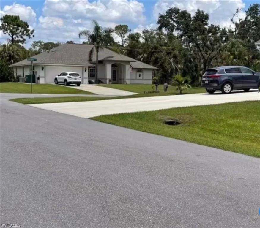 The lote is across this street and the house