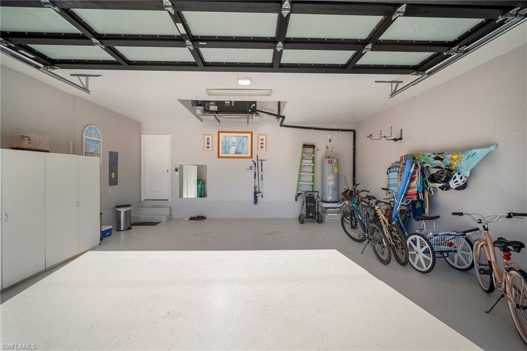 Garage with water heater and electric panel