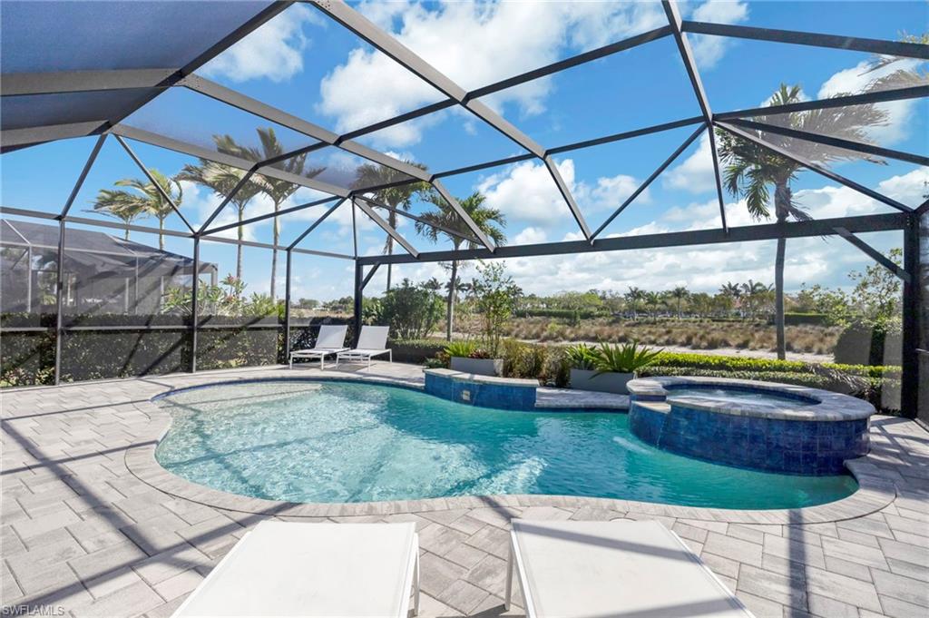 The beautiful, heated, saltwater pool and spillover spa are complimented by the waterfall feature