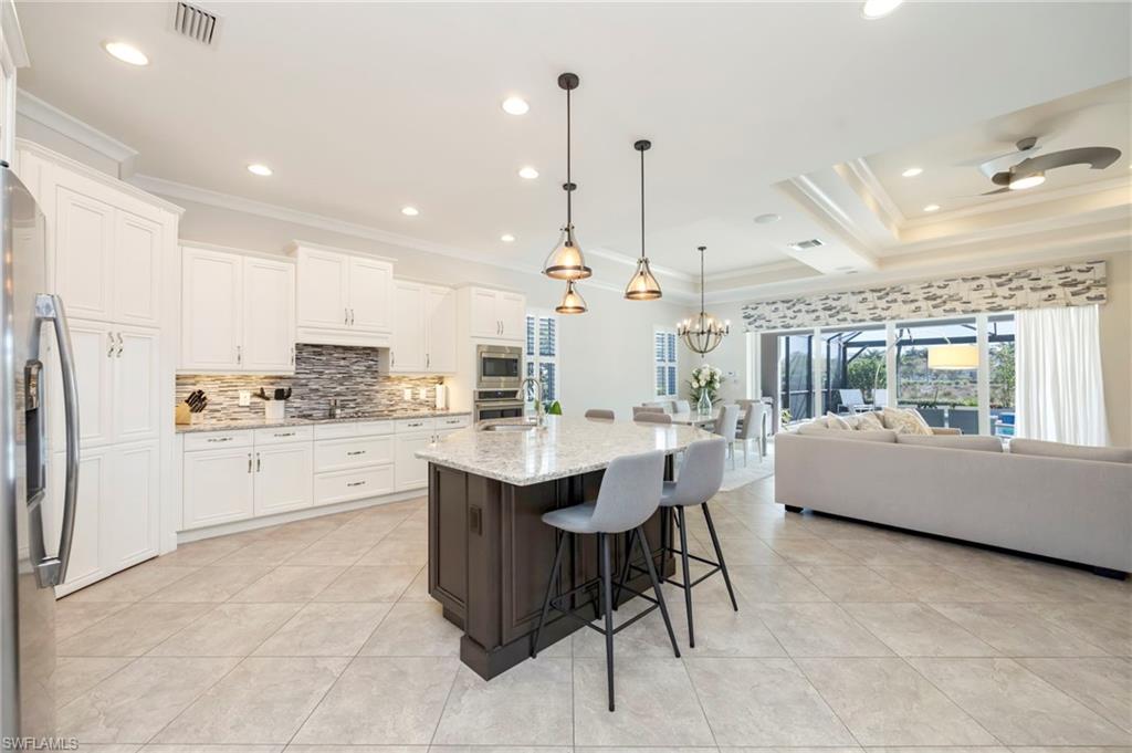 Walk-in pantry, abundant storage, stainless appliances, crown molding, under cabinet lighting and built-in water filter