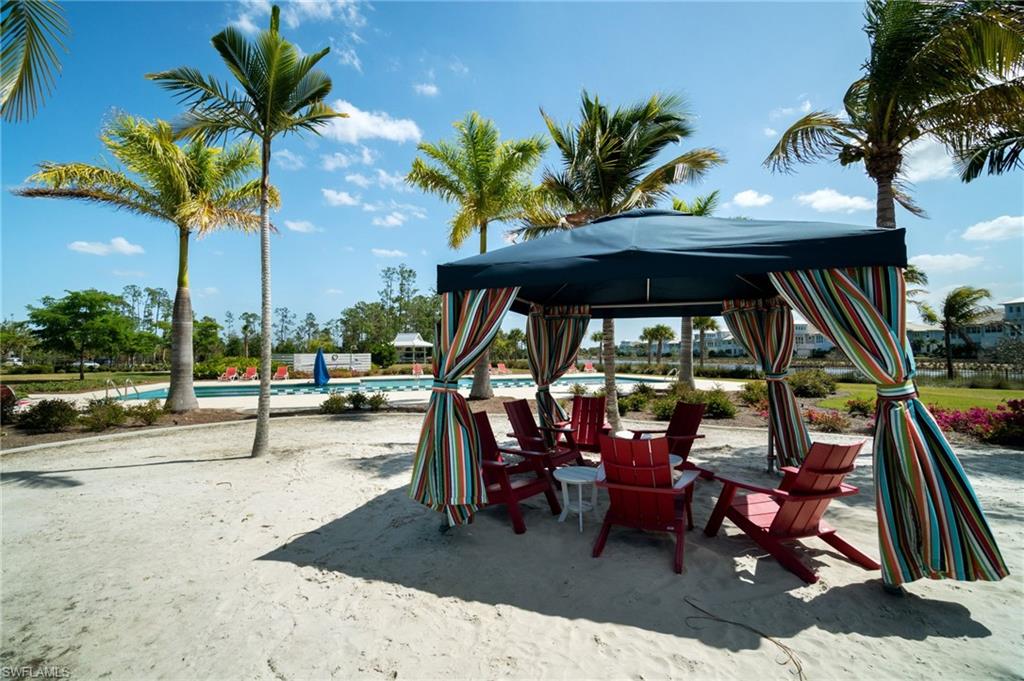 Lap pool and cabanas in the sand