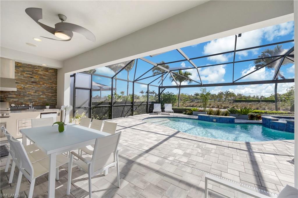 Pavered pool deck with lots of areas to soak up the sun