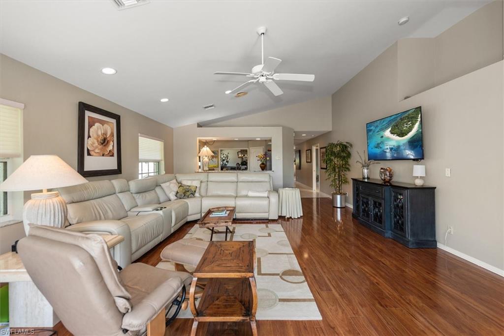 Spacious and bright living room with comfortable leather sectional / recliner sofas