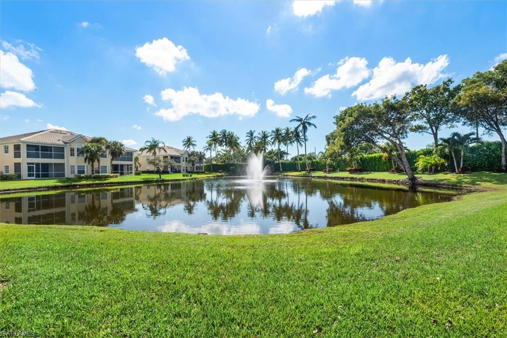condo situated on small lake with water fountain
