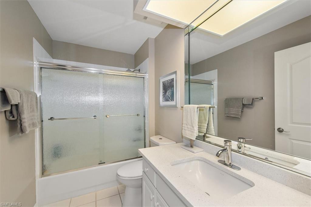 Third bathroom with new quartz counter tops and new fixtures and tub