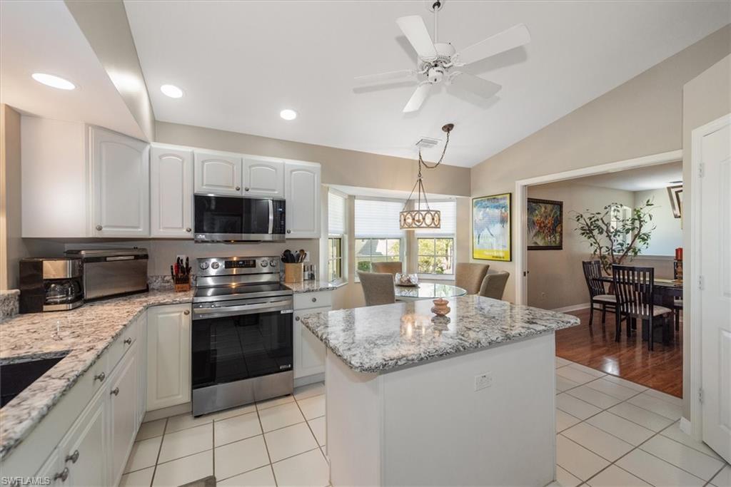 well appointed eat-in kitchen with new appliances, walk-in pantry and center island