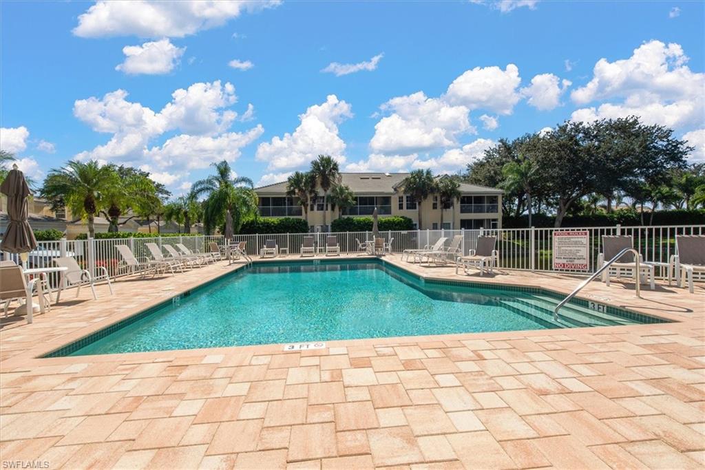 Fenced-in community pool and spa