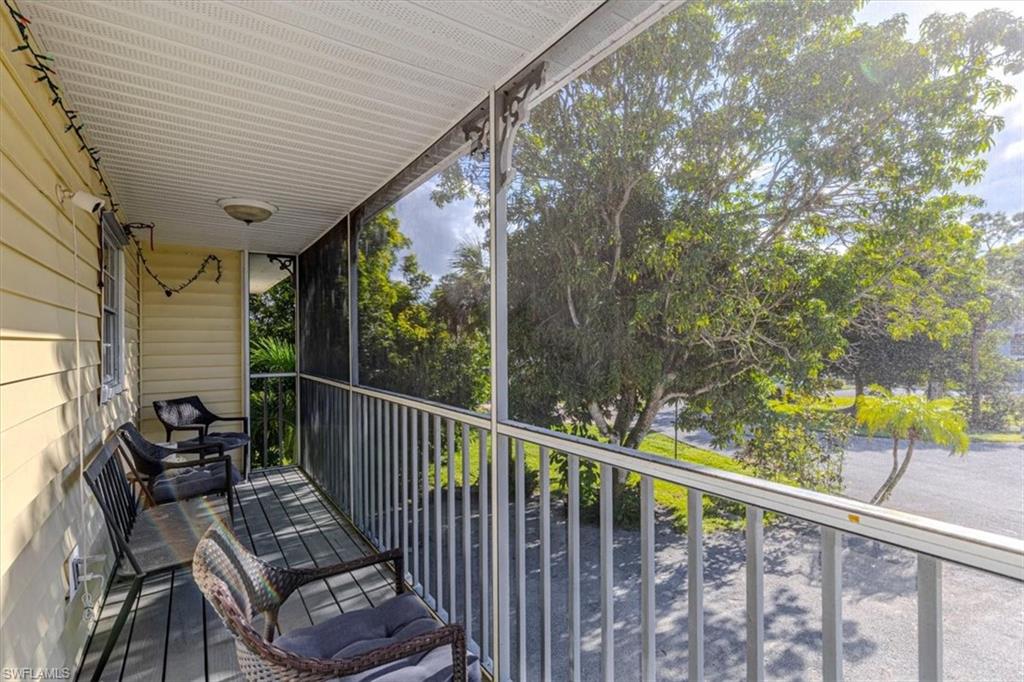 Sunroom / solarium featuring a balcony