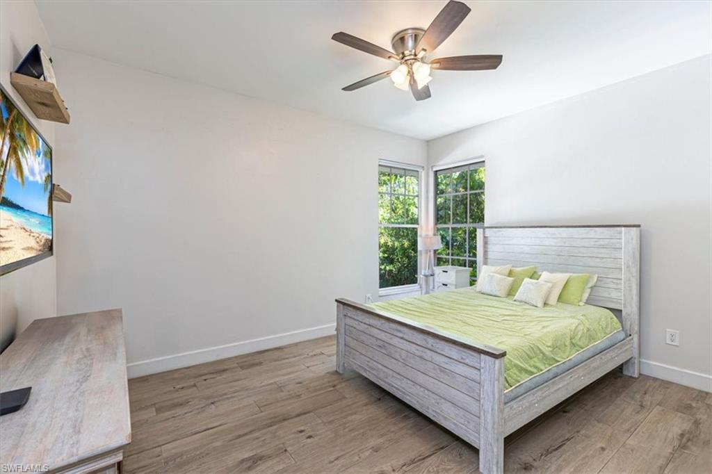 Bedroom with light wood-style flooring and ceiling fan