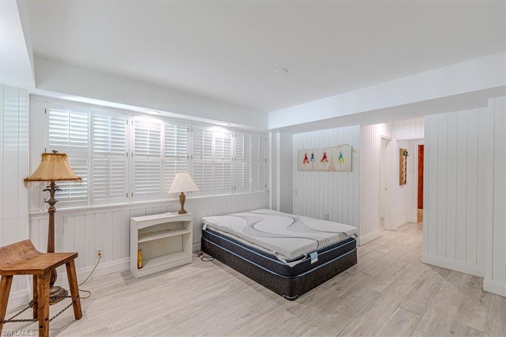 Bedroom featuring light wood-type flooring and baseboards
