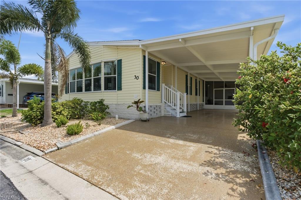 Car port and entrance to living room.