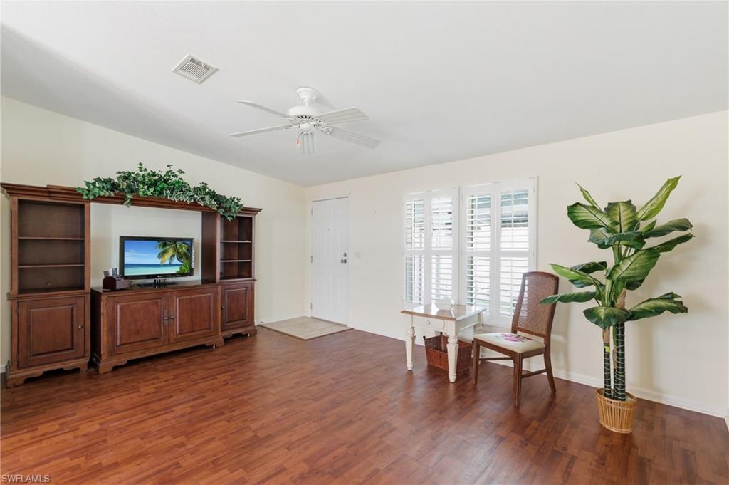 Family room with door to Florida room and car port.
