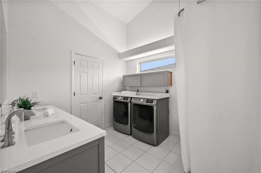Primary bath and laundry combo. Oversized walk-in closet adjacent