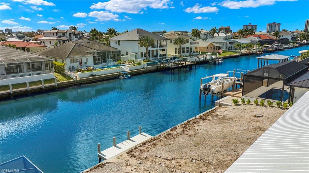 This property features a canal-front location with a private dock