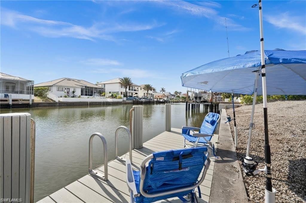 The property includes a private dock with a ladder, providing direct access to the canal
