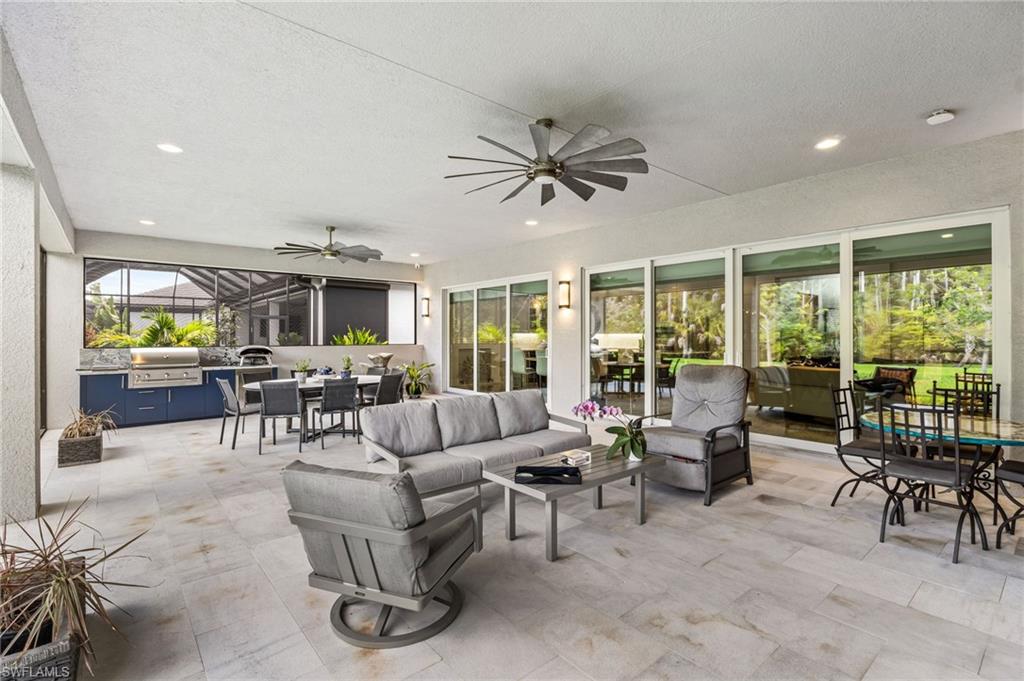 Complete with a summer kitchen with natural gas grill, and a stunning fireplace feature wall, this space is designed for year-round enjoyment while overlooking peaceful preserve scenery and an expansive backyard rarely available in community living.
