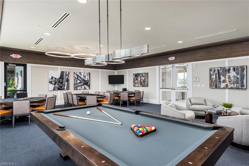 Game room with poker tables and TVs to watch the games.