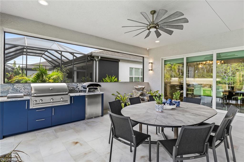 Complete with a summer kitchen with natural gas grill, and a stunning fireplace feature wall, this space is designed for year-round enjoyment while overlooking peaceful preserve scenery and an expansive backyard rarely available in community living.