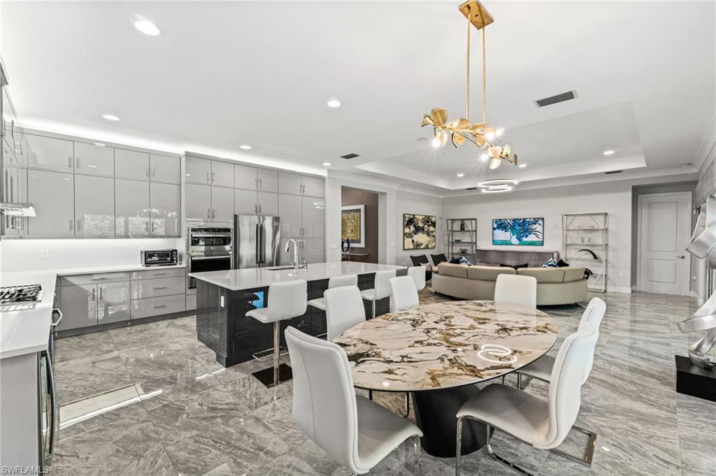 Notice the extended upper cabinetry and glass doors.