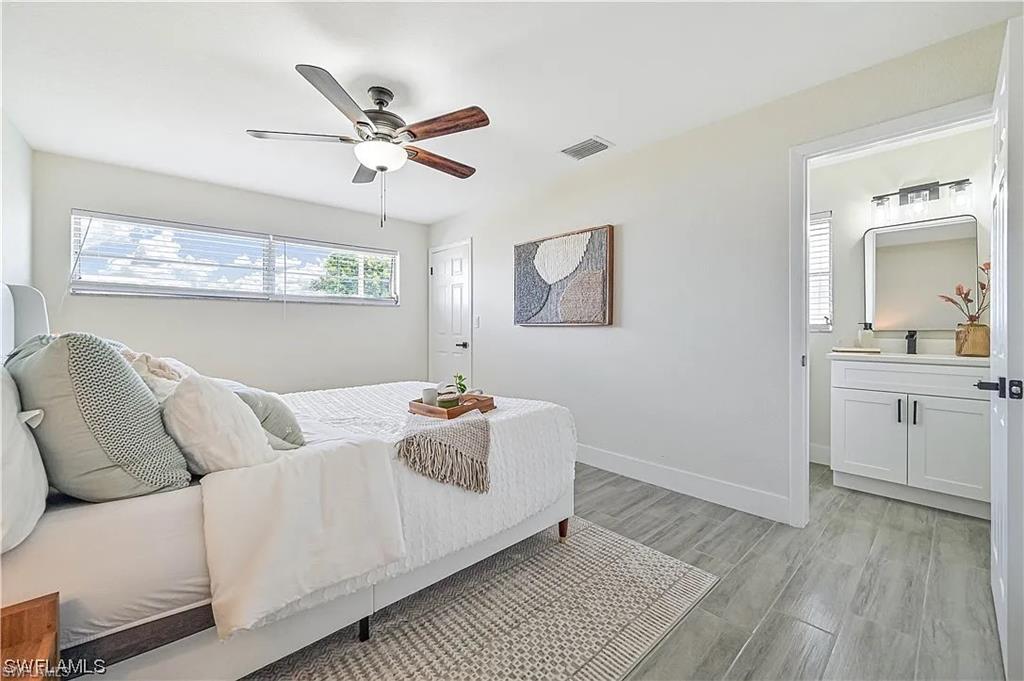 This room offers light-colored walls and tiled flooring throughout