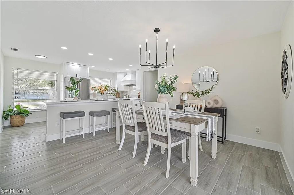 The interior features light-colored walls and grey rectangular tile flooring