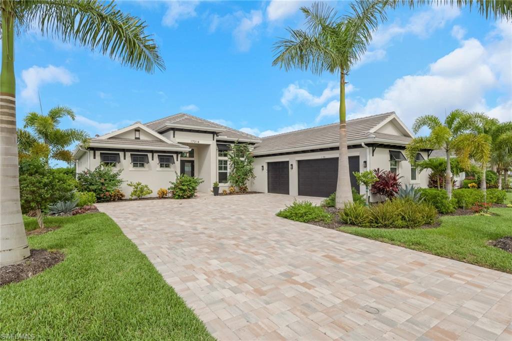 Contemporary exterior with a neutral stucco finish and dark trim accents