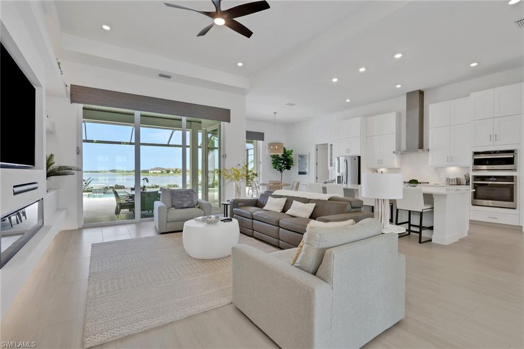 Open-concept living area with a waterfront backdrop