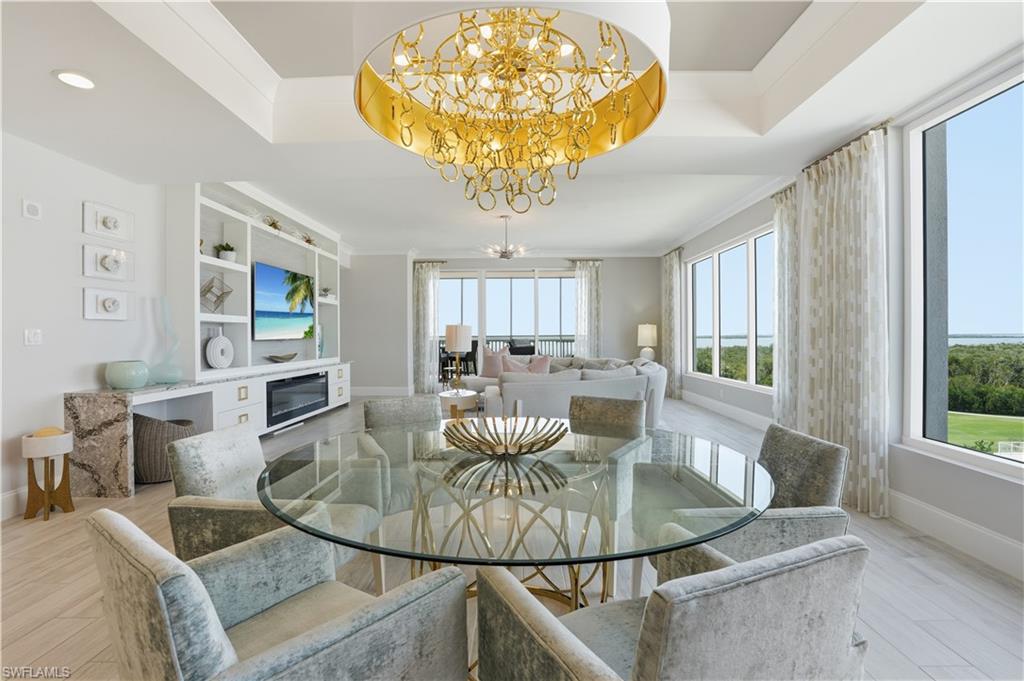 Dine in style under this BEAUTIFUL chandelier and tray ceiling.