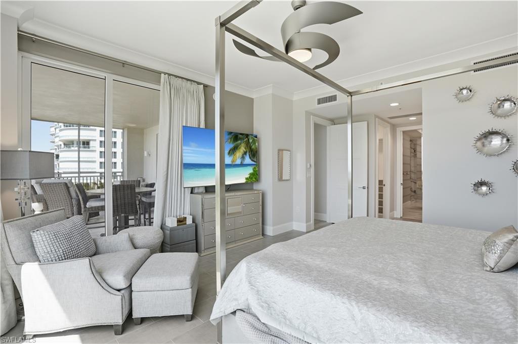 The primary bedroom suite boasts lanai access and 2 large closets with custom built-ins.