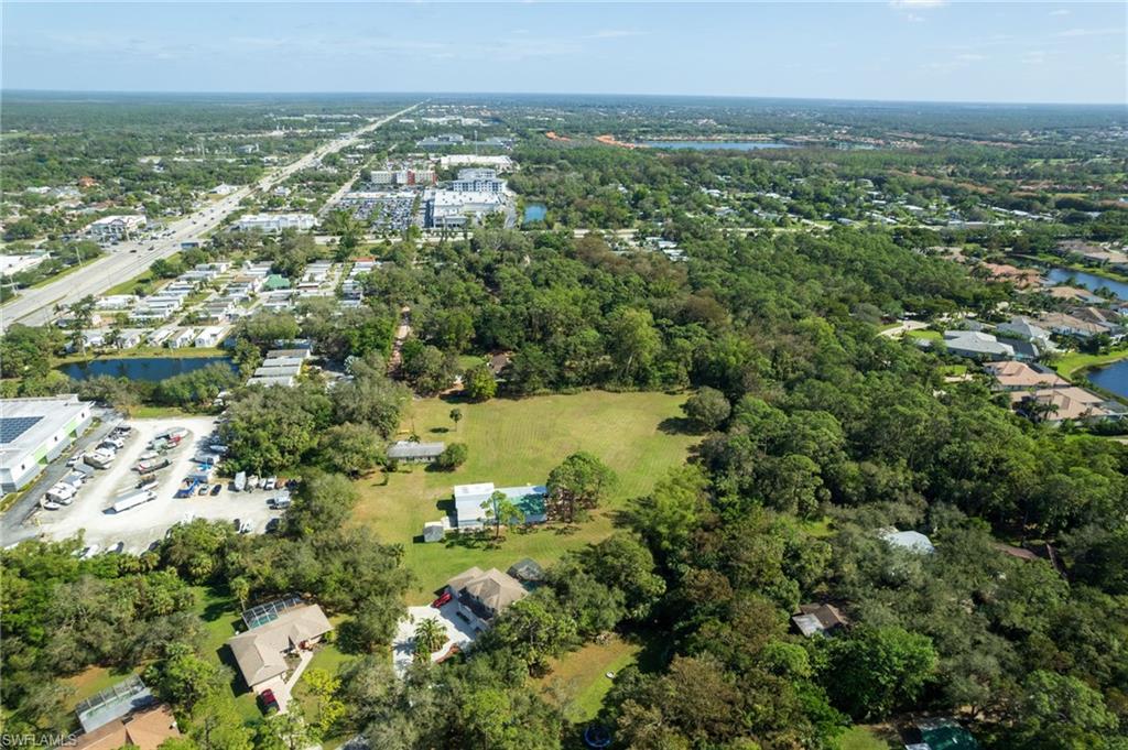 Expansive lot featuring a large cleared area and surrounding mature trees