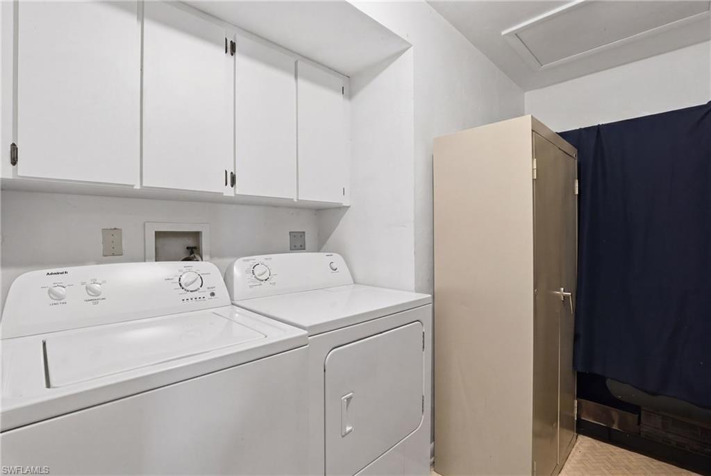 Laundry area featuring white cabinetry, a built-in washing machine connection, and a ceiling access panel