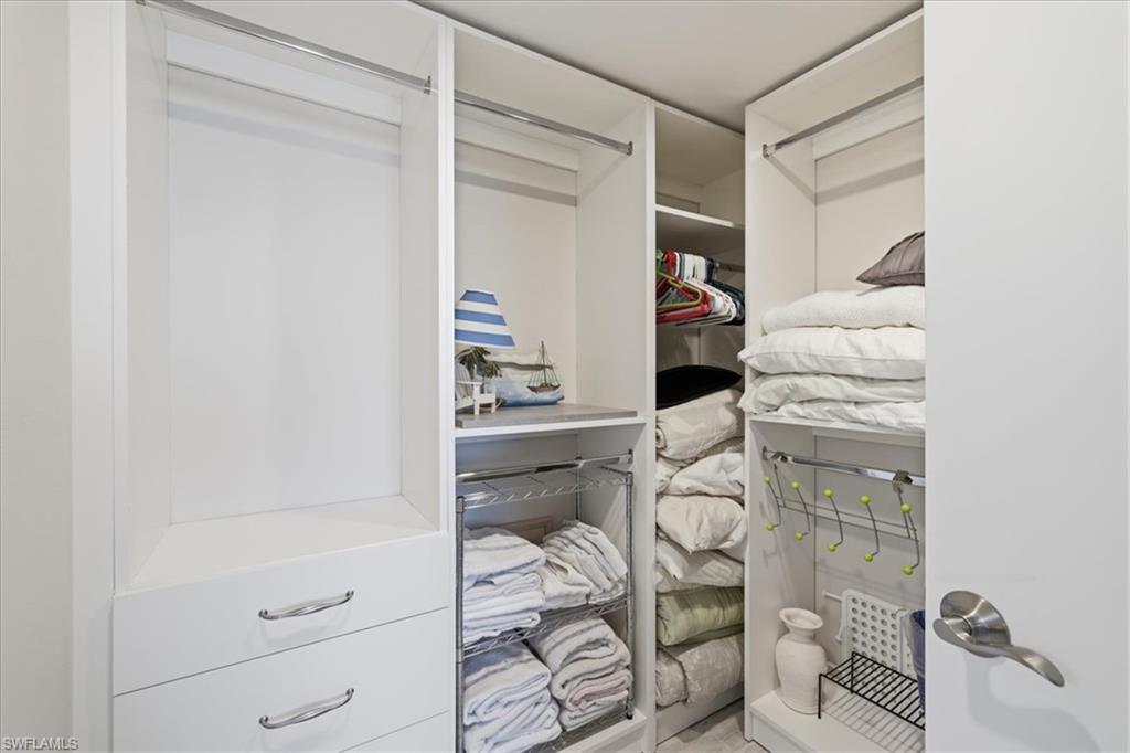 Primary Closet with built in shelving