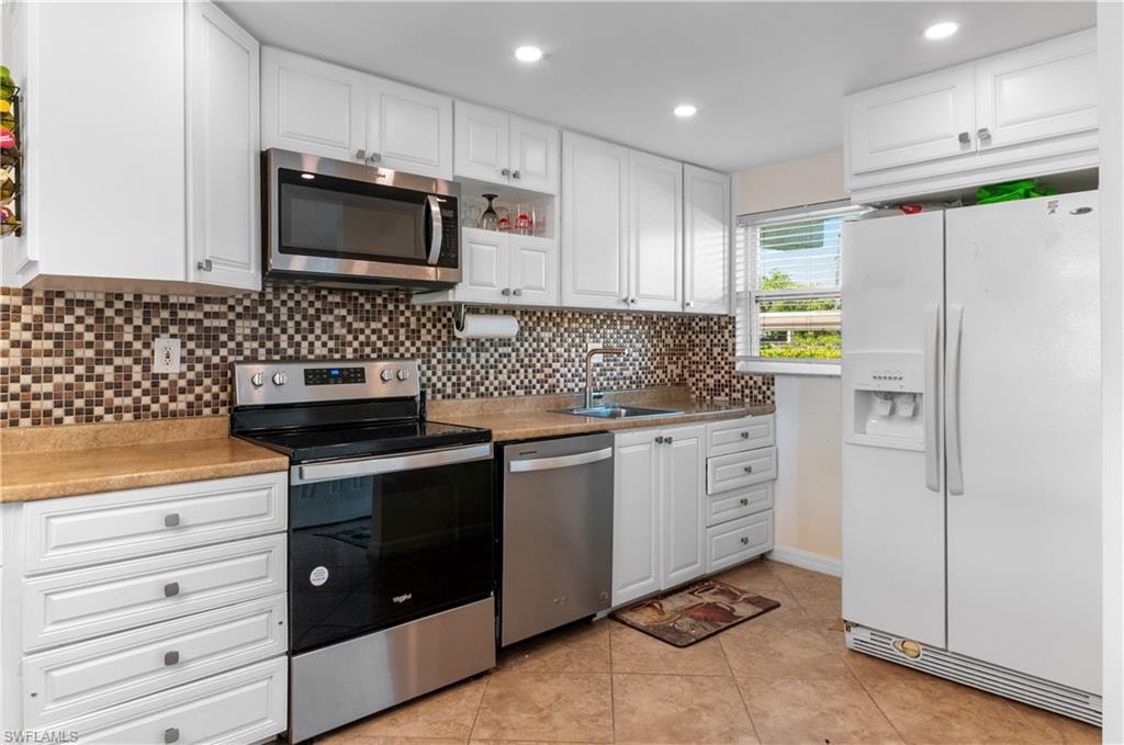 Newer kitchen cabinets and appliances, impact windows.