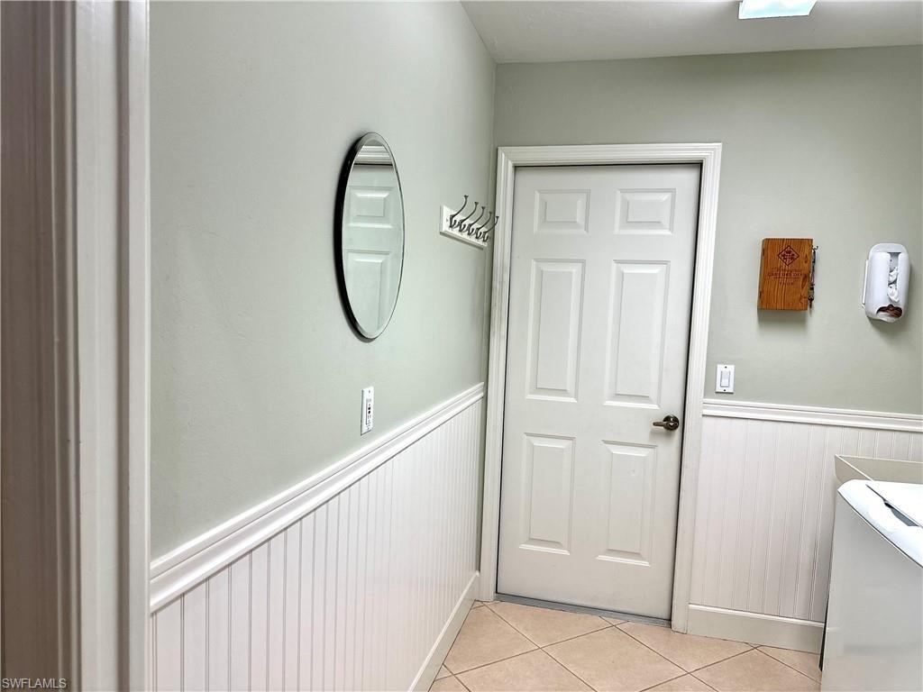 The wainscoting gives the laundry room a fresh look, and provides a pleasant entry from the garage.