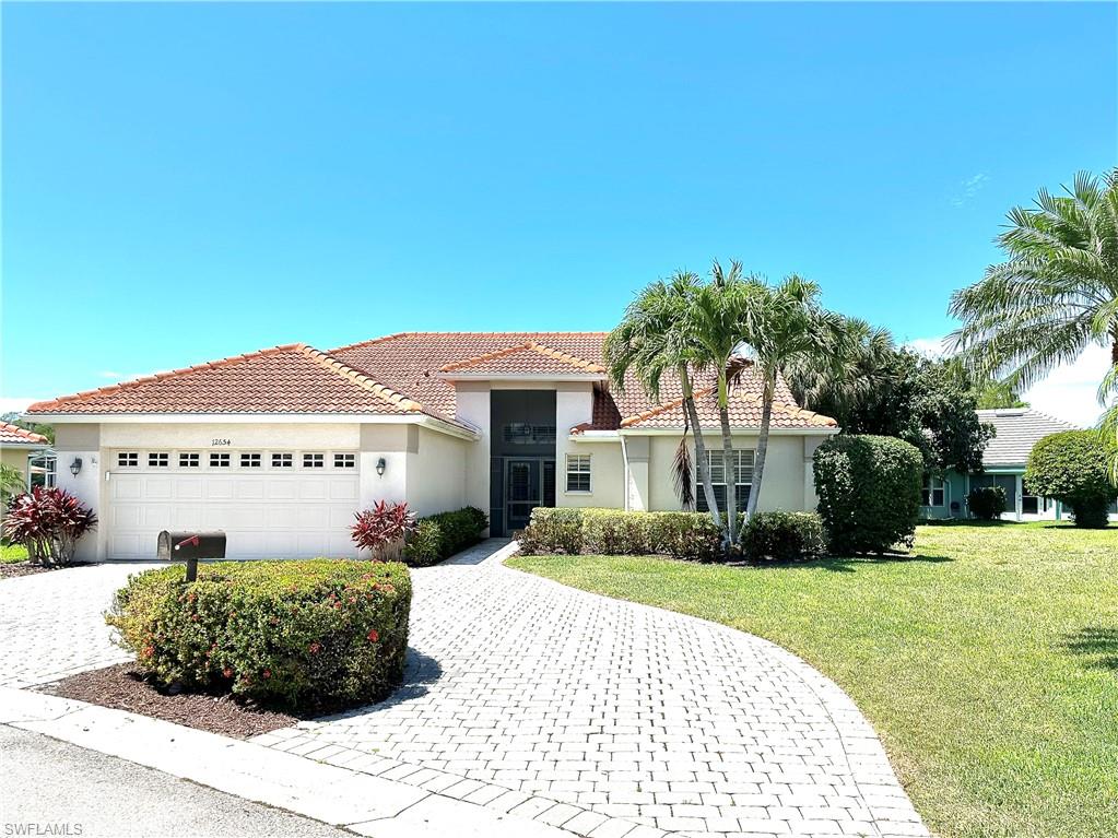The circular, paver driveway adds curb appeal and convenience for the owner.
