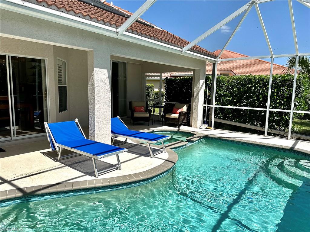 The screened patio/pool area provides both sunny and shaded areas to enjoy.