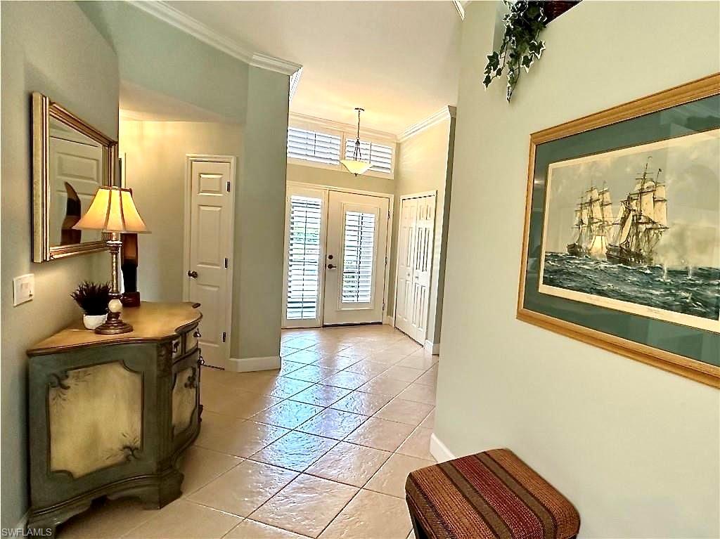 The front entry is open and airy.  The entry door and the windows throughout the house have plantation shutters.  A nice feature for southern homes, and also an added value.