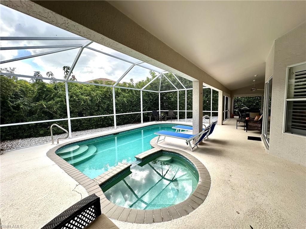 The pool features a built in hot tub/spa.