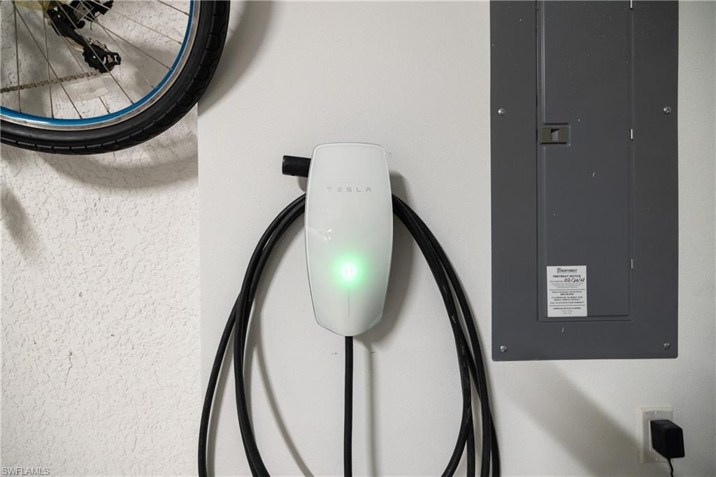Wall-mounted electric vehicle charging station