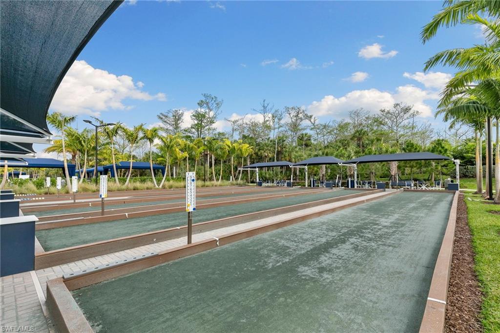 Bocce ball courts featuring multiple playing lanes and covered seating areas