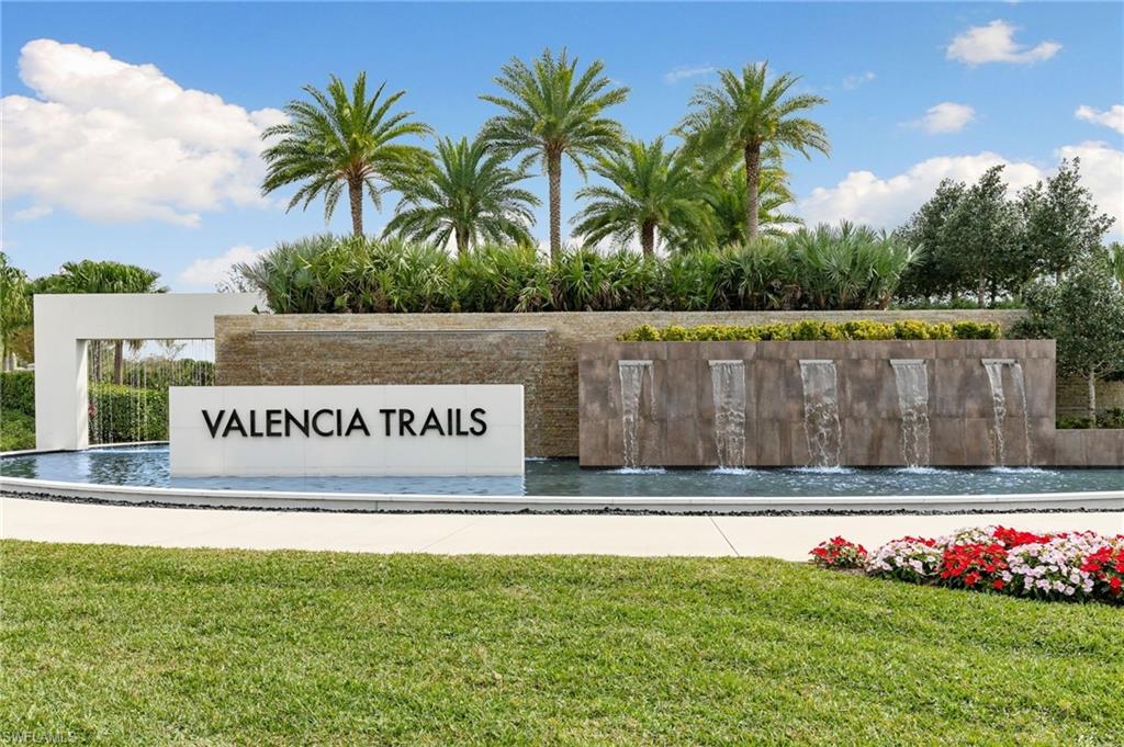 Welcome home!! to "Valencia Trails", a multi-tiered gorgeous water feature with multiple cascades, and mature palm trees