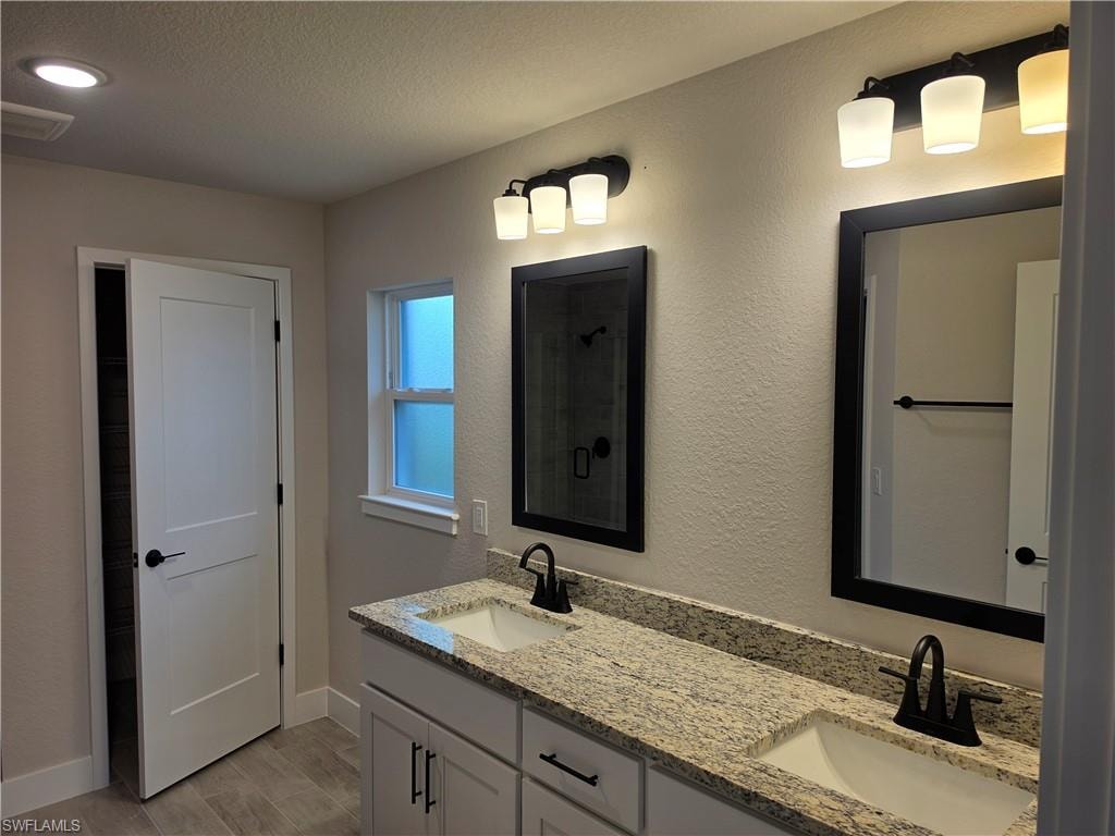 Dual vanity with granite countertop and integrated sinks