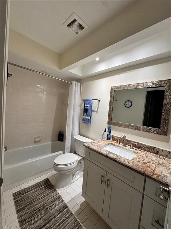Bathroom featuring a single vanity with granite countertop, undermount sink, and light-toned cabinetry