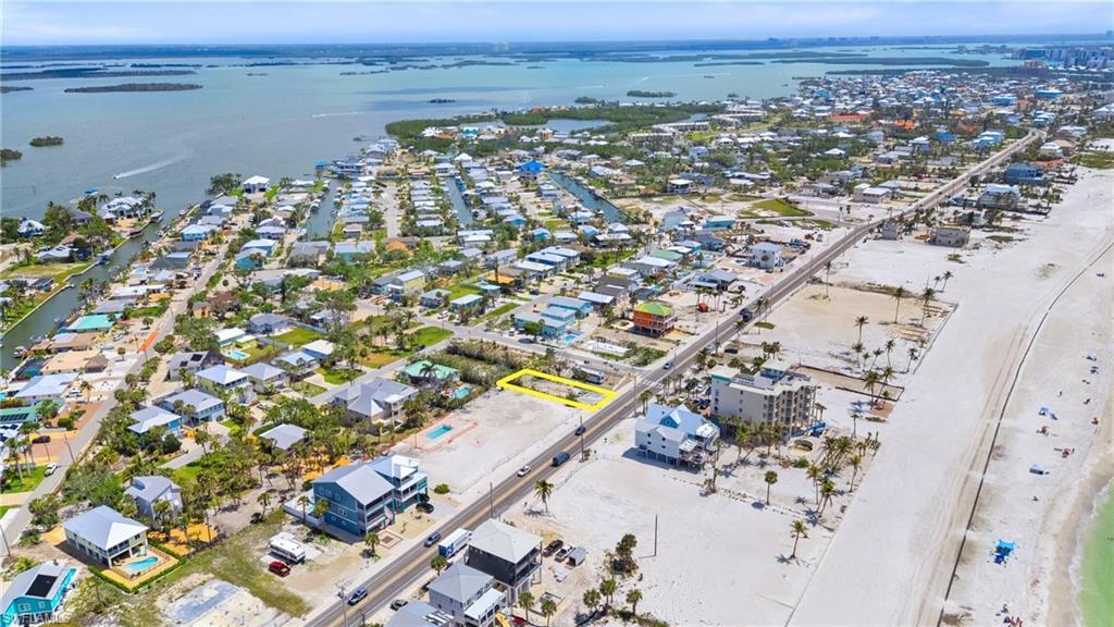 Drone / aerial view with a residential view and a water view  - Virtually Edited Image